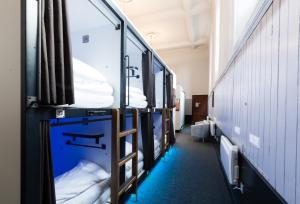 a row of bunk beds in a room at CoDE Pod – The CoURT - Edinburgh in Edinburgh