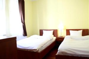 Postel nebo postele na pokoji v ubytování Hotel Vera