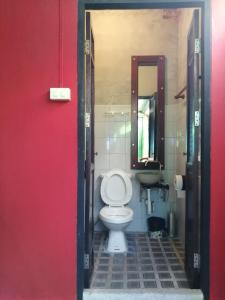 a bathroom with a toilet and a sink at Baan Tepa Boutique House in Bangkok +32 photos