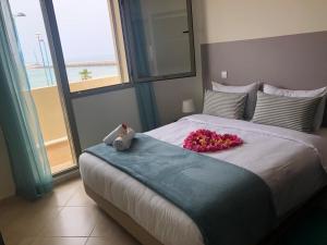 Postel nebo postele na pokoji v ubytování Kenz Mehdia Hotel Resort + 51 fotografií