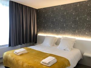 Postel nebo postele na pokoji v ubytování Acropolis - Luxury Appartments I Hotelservice and parking