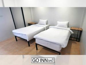 Katil atau katil-katil dalam bilik di Go Inn Phuket old Town
