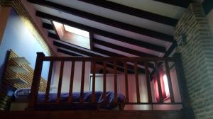 a room with a staircase with a bed in it at COSY DOUBLE ROOM + PRIVATE BATHROOM SEVILLA CENTER in Seville