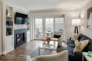 
a living room filled with furniture and a fireplace at Wentworth by the Sea, A Marriott Hotel & Spa in New Castle
