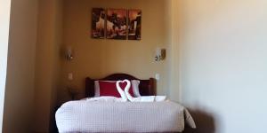 Giường trong phòng chung tại Kuska Hostal
