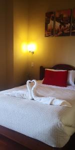 Giường trong phòng chung tại Kuska Hostal