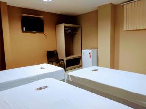 Pousada Café Com Leitte客房内的一张或多张床位