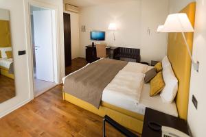 Кровать или кровати в номере Hotel Meridiana