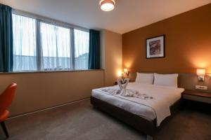 Voodi või voodid majutusasutuse Sky Corner Hotel toas