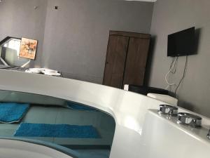 a bathroom with a sink and a toilet and a mirror at Hotelwhite Family Gjilan in Gjilan +8 photos