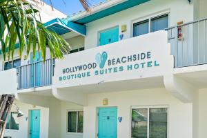 a building with a sign on the front of it at Hollywood Beachside Boutique Suite in Hollywood