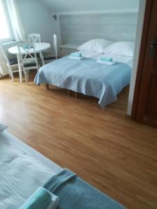Pokoje gościnne Jutrzenka客房内的一张或多张床位