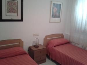 A bed or beds in a room at Residencial Itxaso 6/8 LEK