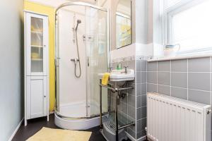 a bathroom with a shower and a sink at The Ravensbourne Hotel in Bournemouth