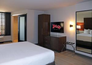 a hotel room with a bed and a television at Plaza Hotel & Casino in Las Vegas