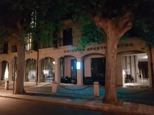 a building on a street at night at Hotel AV Apartamentos Lobios in Lobios