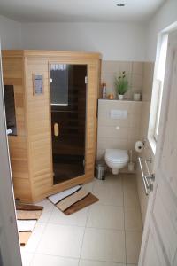 a bathroom with a shower and a toilet at Breeger Boddenidyll in Breege