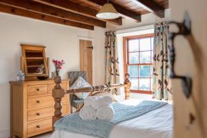 Postel nebo postele na pokoji v ubytování The Cottage Gillamoor
