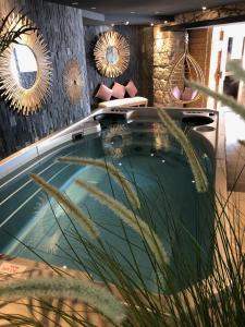 a swimming pool in a room with mirrors at Boutique Hotel & Spa la Villa Cap Ferrat in Saint-Jean-Cap-Ferrat
