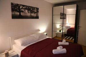 Postel nebo postele na pokoji v ubytování Oaza Apartman Arena Zagreb 2
