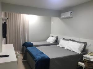 Ένα ή περισσότερα κρεβάτια σε δωμάτιο στο Sian Apart Hotel Garvey
