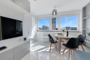 Telewizja i/lub zestaw kina domowego w obiekcie P&O Apartments Zgoda