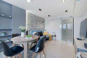 Telewizja i/lub zestaw kina domowego w obiekcie P&O Apartments Zgoda