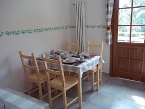 a dining room table with chairs and a table cloth at Agriturismo Rio Castello in Marina di Andora