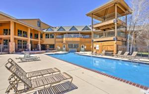 a resort with a swimming pool and lounge chairs at DOCO Rocky Mountain Vacation Rental-Queen Suite with Resort Amenities in Granby