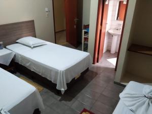 Rúm í herbergi á FRONTIER PALACE HOTEL