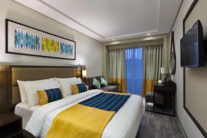 Belmont Hotel Boracay tesisinde bir odada yatak veya yataklar