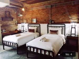 Ein Bett oder Betten in einem Zimmer der Unterkunft PX122 DBEST HOTEL