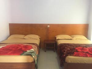 Tempat tidur dalam kamar di Homestay Lereng Bromo