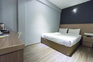 Postel nebo postele na pokoji v ubytování Hotel 99 SS2 Petaling Jaya
