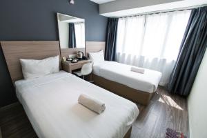 Postel nebo postele na pokoji v ubytování Hotel 99 SS2 Petaling Jaya