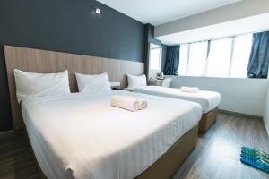 Postel nebo postele na pokoji v ubytování Hotel 99 SS2 Petaling Jaya