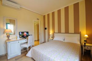 Postel nebo postele na pokoji v ubytování Hotel Dei Conti