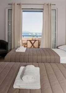 Ένα ή περισσότερα κρεβάτια σε δωμάτιο στο Anesis Hotel