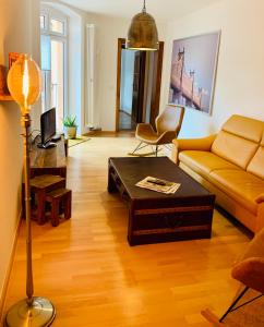 a living room with a couch and a coffee table at Moderne Wohnung in Eberswalde in Eberswalde