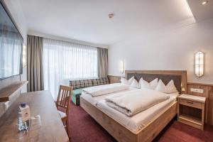 Posteľ alebo postele v izbe v ubytovaní Hotel Serles