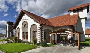 a building with bikes parked outside of it at Rezort Masarykov dvor in Pstruša
