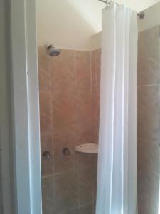 a bathroom with a shower with a shower curtain at Vuya Nathi Bed and Breakfast in Manzini +46 photos