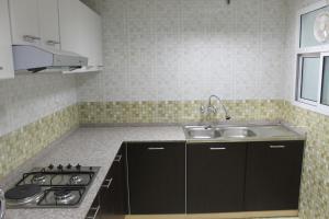 Kuchyň nebo kuchyňský kout v ubytování Horizon Hotel Apartments - الأفق للشقق الفندقية