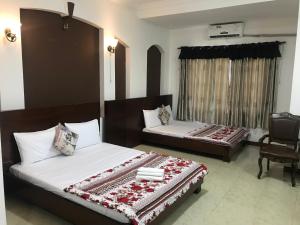 Łóżko lub łóżka w pokoju w obiekcie Nhật Vân 1