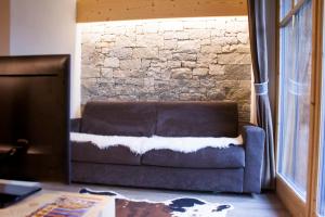 A seating area at CHALET REMI - DOMIN