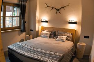 A bed or beds in a room at CHALET REMI - DOMIN