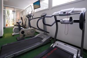 a gym with several treadmills and a treadmill at Luxor Cattolica Beach Hotel in Cattolica