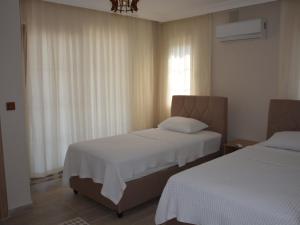 A bed or beds in a room at Konak Sari
