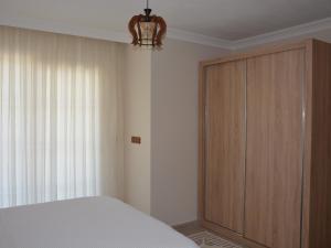 A bed or beds in a room at Konak Sari