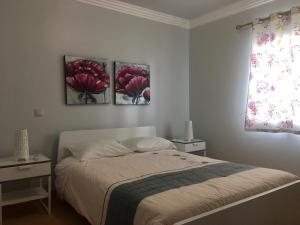 Ένα ή περισσότερα κρεβάτια σε δωμάτιο στο Casa das Figuras